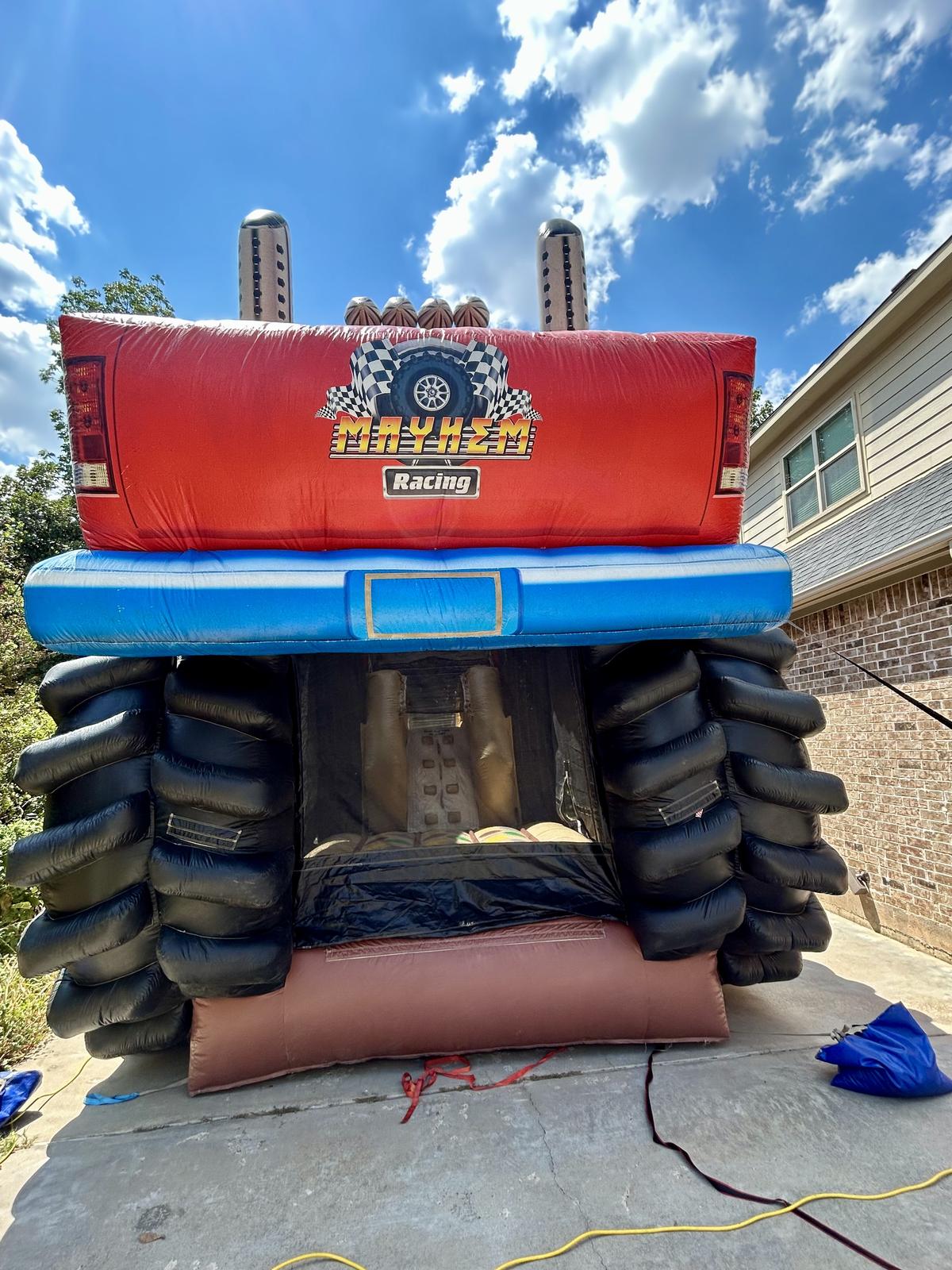 Front view of the XL Monster Truck combo bounce house set up for a Pottsboro, TX party