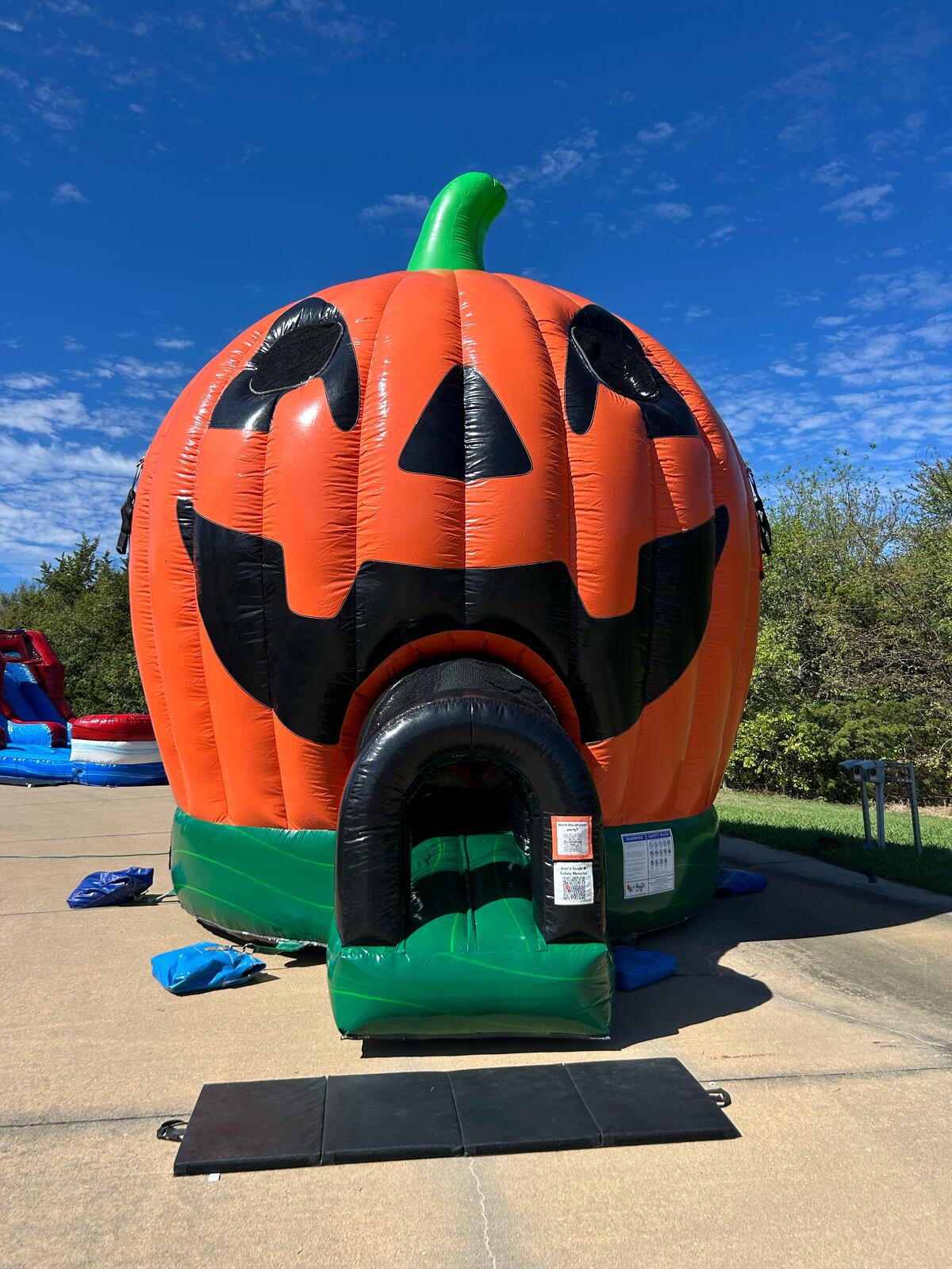 Pumpkin bounce house rental set up in Sherman, TX